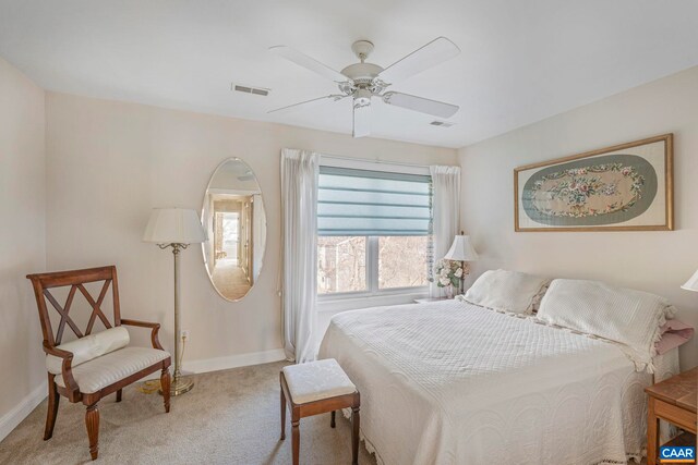 bedroom with ceiling fan, carpet floors, baseboards, and visible vents