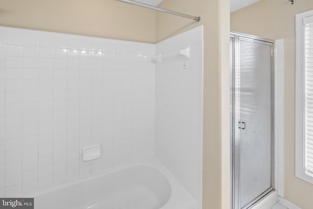 full bathroom with shower / bath combination with glass door