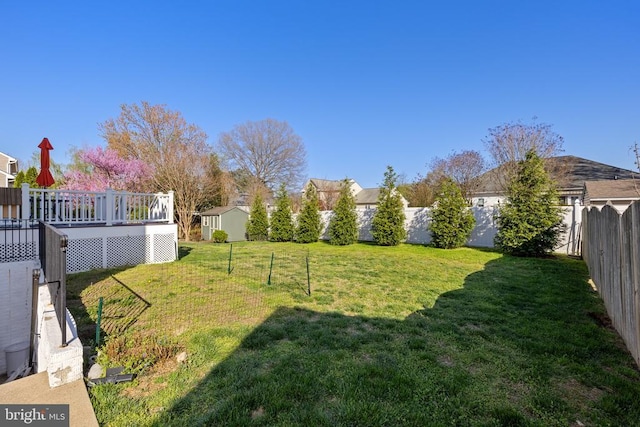 view of yard with a wooden deck