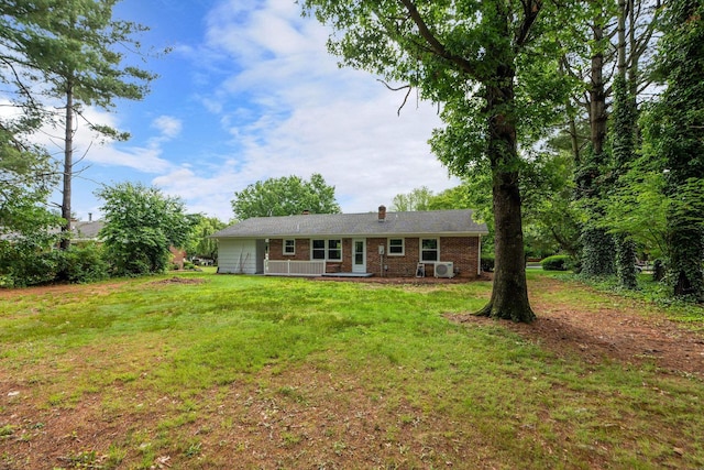 91 Cooper Dr, Stuarts Draft, VA 24477 - view of front of house featuring brick siding, a front yard, a chimney, and ac unit