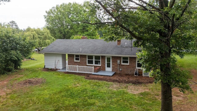 91 Cooper Dr, Stuarts Draft, VA 24477 - view of front facade with a chimney, a front lawn, brick siding, and a shingled roof
