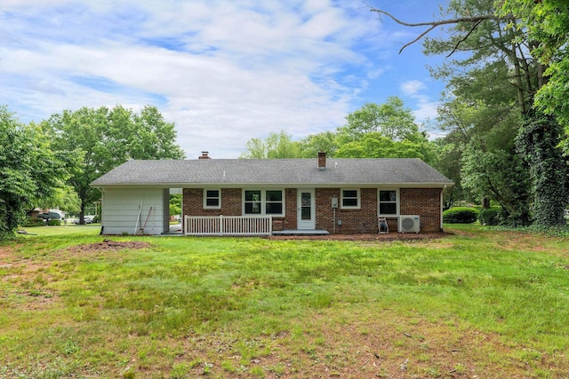 91 Cooper Dr, Stuarts Draft, VA 24477 - view of front facade with a cooling unit, a front yard, a chimney, and brick siding