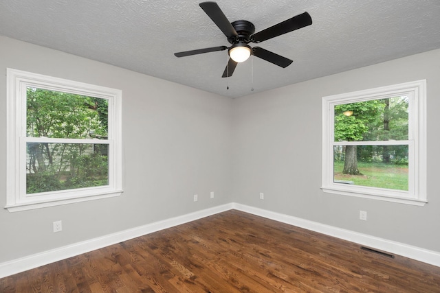 91 Cooper Dr, Stuarts Draft, VA 24477 - unfurnished room with plenty of natural light, dark wood finished floors, baseboards, a textured ceiling, and a ceiling fan
