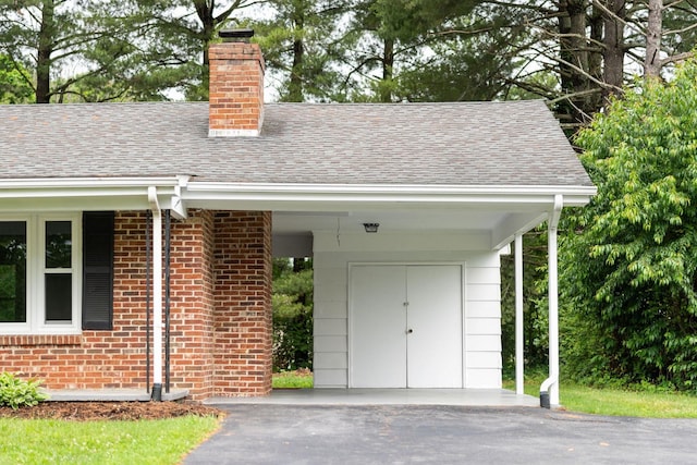 91 Cooper Dr, Stuarts Draft, VA 24477 - doorway to property with a chimney, a shingled roof, brick siding, and driveway