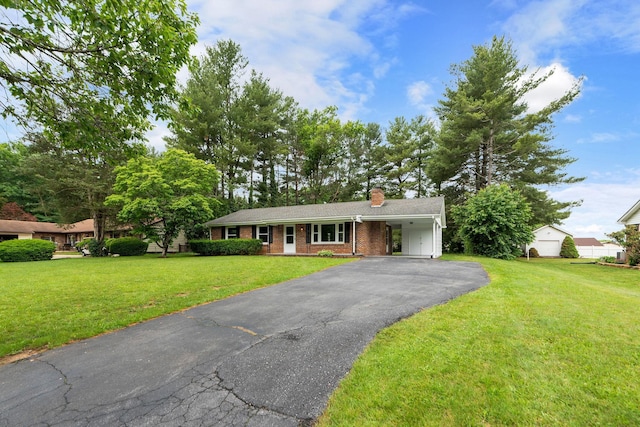 91 Cooper Dr, Stuarts Draft, VA 24477 - ranch-style home with asphalt driveway, a chimney, a front yard, a carport, and brick siding