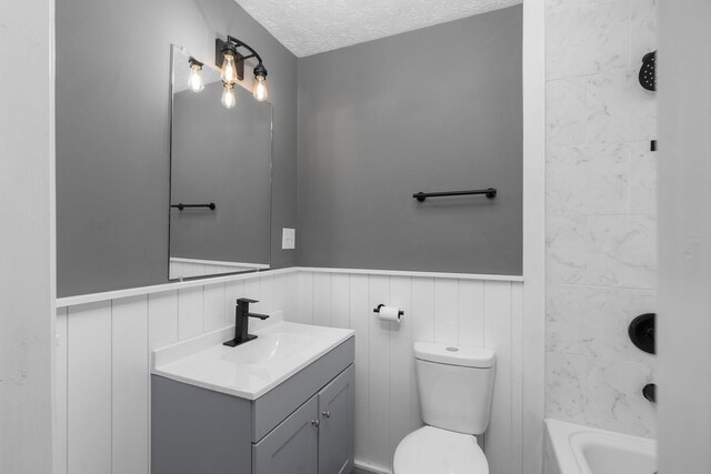 91 Cooper Dr, Stuarts Draft, VA 24477 - full bathroom with vanity, wainscoting, toilet, a textured ceiling, and shower / tub combination
