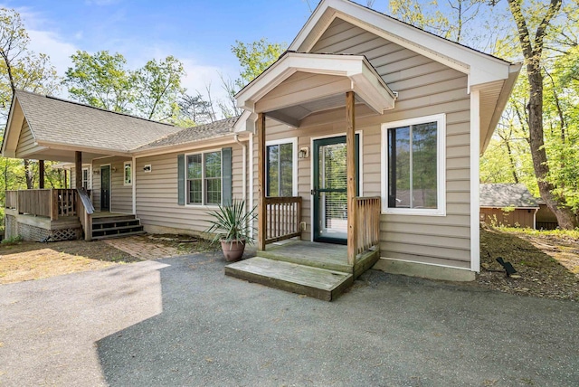 392 Passage Ln, Mcgaheysville, VA 22840 - rear view of house featuring a shingled roof and a patio