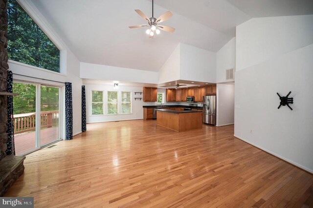 614 Yorktown Blvd, Locust Grove, VA 22508 - unfurnished living room featuring high vaulted ceiling, a ceiling fan, light wood finished floors, and baseboards