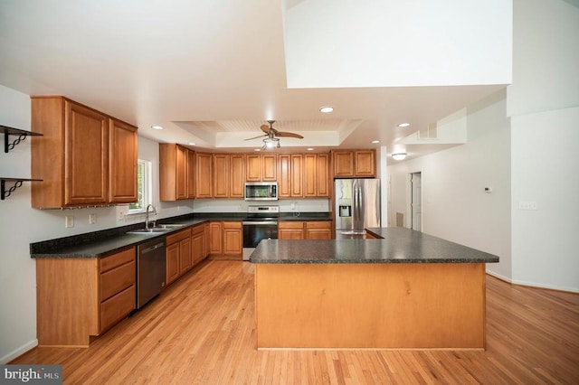 614 Yorktown Blvd, Locust Grove, VA 22508 - kitchen with appliances with stainless steel finishes, a tray ceiling, a sink, light wood finished floors, and recessed lighting