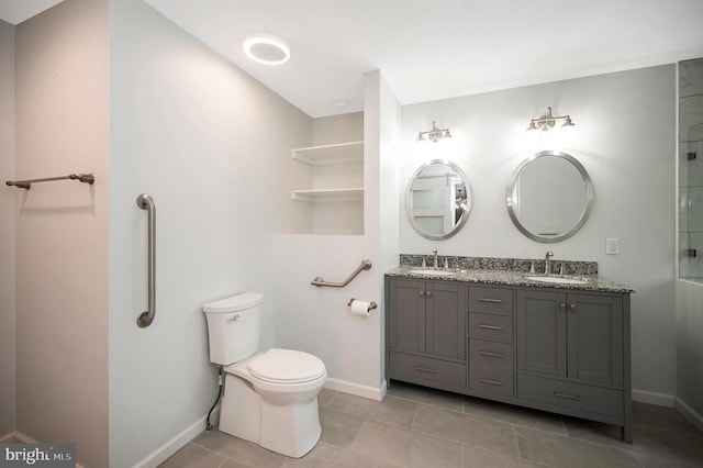 614 Yorktown Blvd, Locust Grove, VA 22508 - bathroom featuring double vanity, toilet, baseboards, and tile patterned flooring