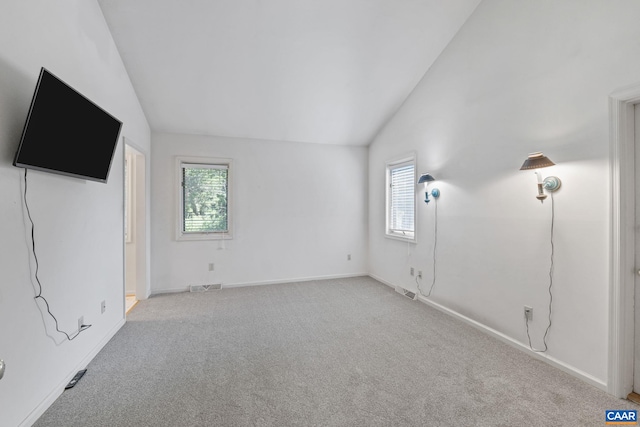 4870 Mechums River Rd, Charlottesville, VA 22901 - unfurnished bedroom with lofted ceiling, multiple windows, and carpet