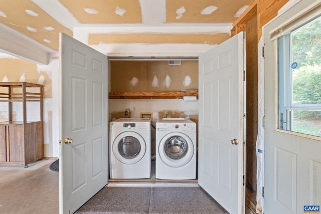 4870 Mechums River Rd, Charlottesville, VA 22901 - laundry area with washing machine and clothes dryer and healthy amount of natural light
