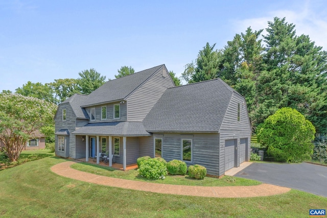 4870 Mechums River Rd, Charlottesville, VA 22901 - view of front of home featuring roof with shingles, covered porch, a front lawn, a garage, and asphalt driveway