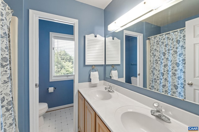 4870 Mechums River Rd, Charlottesville, VA 22901 - bathroom featuring double vanity, tile patterned floors, and a shower with curtain