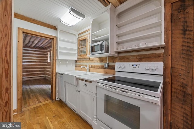 935 River Lodge Rd, Luray, VA 22835 - kitchen with stainless steel appliances, open shelves, a sink, light wood-style flooring, and light countertops