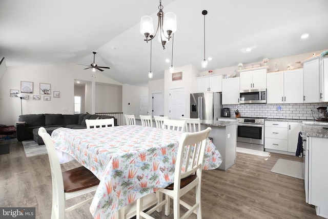 5223 Wyndemere Cir, Mineral, VA 23117 - dining space featuring lofted ceiling, light wood finished floors, and a ceiling fan