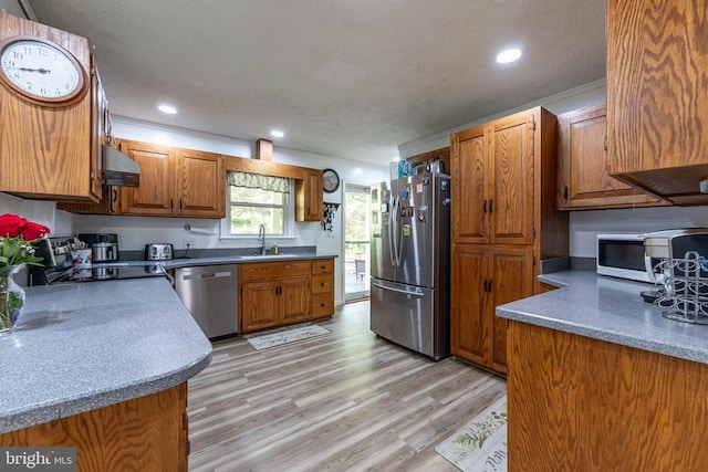 571 Cc Rd, Hood, VA 22723 - kitchen featuring stainless steel appliances, a sink, brown cabinetry, under cabinet range hood, and light wood-type flooring