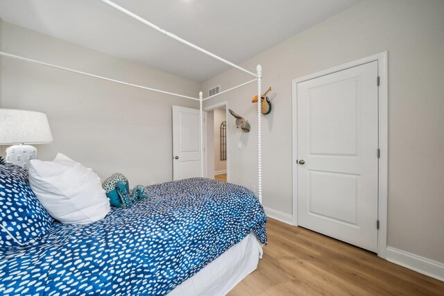 14736 Green View Dr, Elkton, VA 22827 - bedroom with baseboards, visible vents, and light wood-style floors