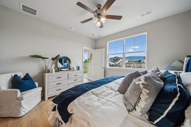 14736 Green View Dr, Elkton, VA 22827 - bedroom featuring light wood-type flooring, visible vents, and a ceiling fan