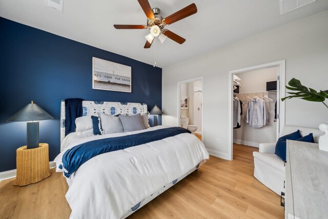 14736 Green View Dr, Elkton, VA 22827 - bedroom with light wood-style floors, a spacious closet, and baseboards