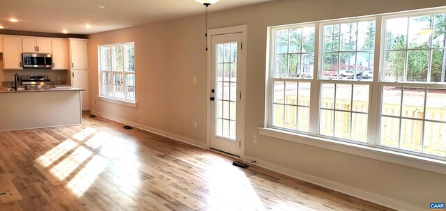 interior space with sink and light wood-type flooring