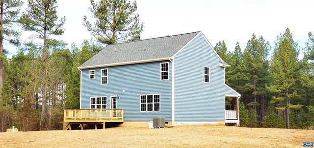 back of property featuring a wooden deck and central AC