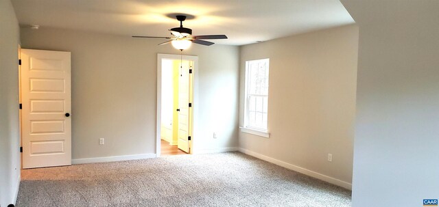 carpeted empty room with ceiling fan