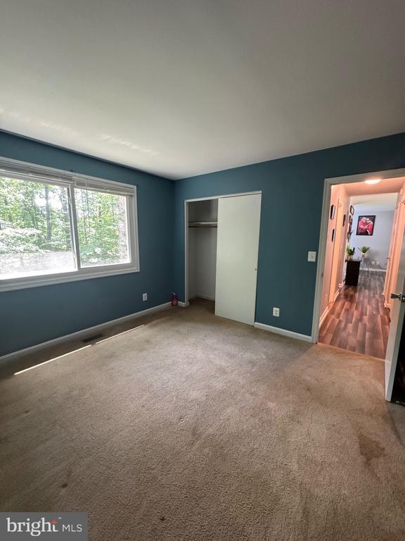 800 Dunlap St, Fredericksburg, VA 22407 - unfurnished bedroom featuring carpet flooring and a closet