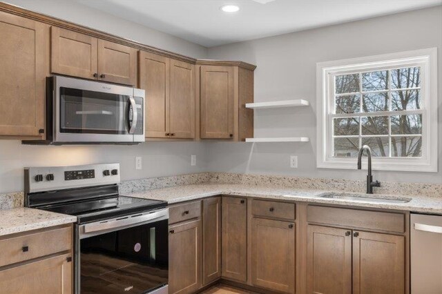1028 D St, Waynesboro, VA 22980 - kitchen featuring appliances with stainless steel finishes, a sink, light stone counters, open shelves, and recessed lighting