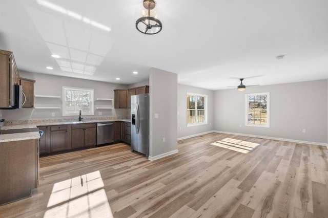 1028 D St, Waynesboro, VA 22980 - kitchen featuring appliances with stainless steel finishes, open shelves, open floor plan, baseboards, and recessed lighting