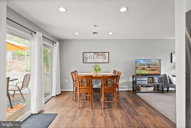  - dining space with a baseboard radiator, recessed lighting, wood finished floors, and baseboards