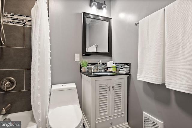  - full bathroom with toilet, shower / bathtub combination with curtain, and vanity
