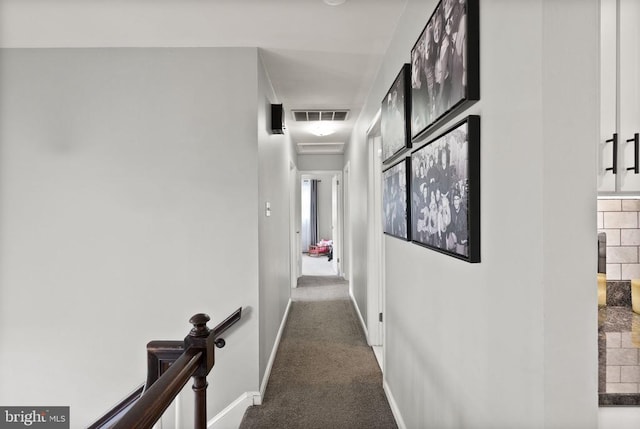  - hallway with carpet and baseboards