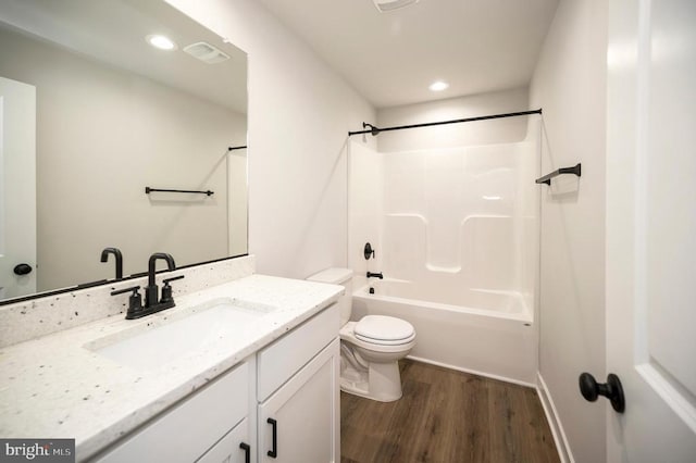 3149 Lewiston Rd, Bumpass, VA 23024 - bathroom with wood finished floors, toilet, vanity,  shower combination, and recessed lighting