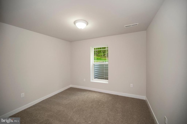 3149 Lewiston Rd, Bumpass, VA 23024 - spare room with baseboards and dark colored carpet