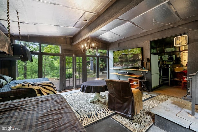 115 Oventop Mountain Ln, Sperryville, VA 22740 - bedroom featuring lofted ceiling, a chandelier, and concrete floors