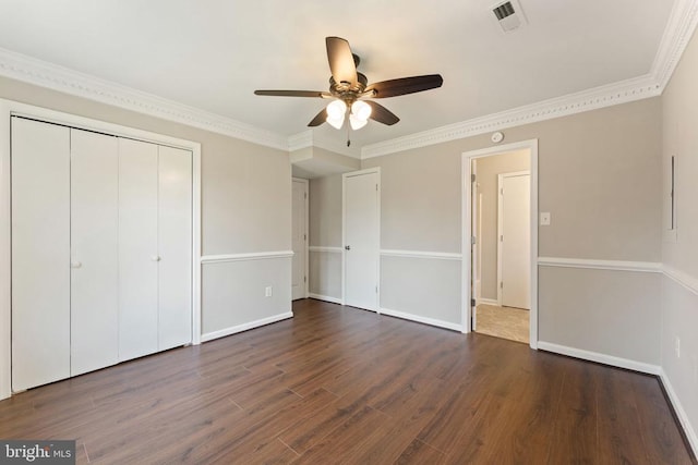 131 Wankoma Dr, Remington, VA 22734 - unfurnished bedroom with dark wood-style flooring, a closet, crown molding, and ceiling fan