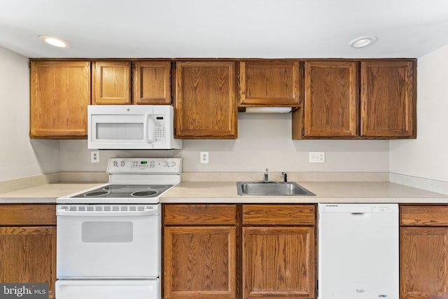 131 Wankoma Dr, Remington, VA 22734 - kitchen with white appliances, light countertops, recessed lighting, and brown cabinets