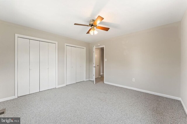 131 Wankoma Dr, Remington, VA 22734 - unfurnished bedroom with multiple closets, carpet, and ceiling fan