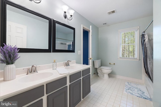  - bathroom with double vanity, toilet, tile patterned floors, shower / bath combo with shower curtain, and baseboards
