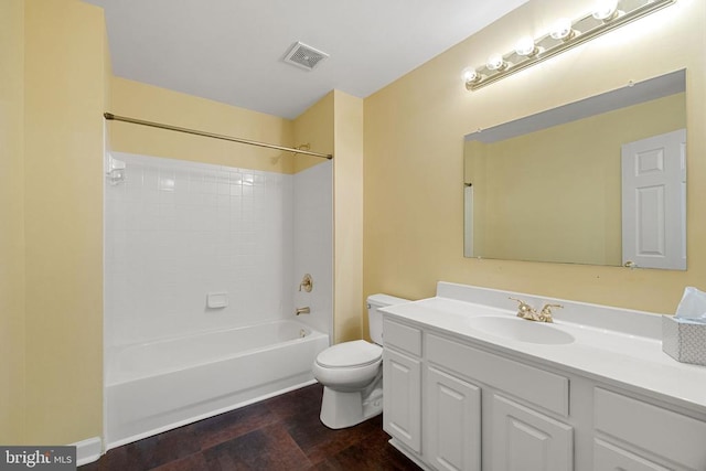  - full bathroom with toilet, vanity, and washtub / shower combination