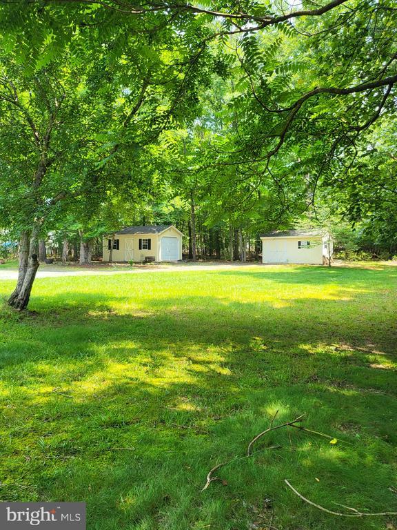 338 Meadow Ridge Rd, Troy, VA 22974 - view of grassy yard featuring a garage and an outdoor structure