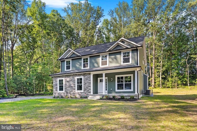 12521 Wilderness Park Dr, Spotsylvania, VA 22551 - view of front facade featuring covered porch, a front yard, and stone siding