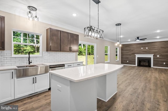 12521 Wilderness Park Dr, Spotsylvania, VA 22551 - kitchen featuring a center island, a glass covered fireplace, ceiling fan, decorative light fixtures, and recessed lighting