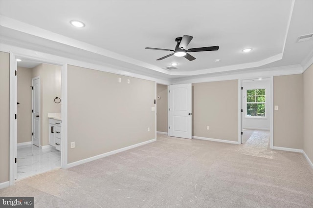 12521 Wilderness Park Dr, Spotsylvania, VA 22551 - unfurnished bedroom featuring a tray ceiling, light carpet, recessed lighting, and ensuite bath