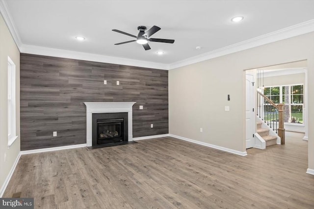 12521 Wilderness Park Dr, Spotsylvania, VA 22551 - unfurnished living room featuring an accent wall, ceiling fan, stairway, ornamental molding, and recessed lighting