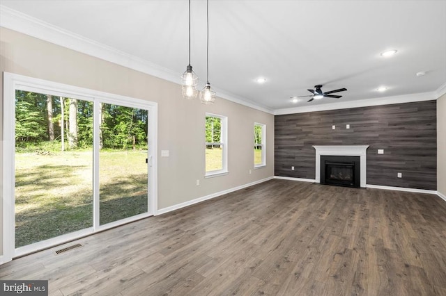 12521 Wilderness Park Dr, Spotsylvania, VA 22551 - unfurnished living room featuring crown molding, a ceiling fan, plenty of natural light, dark wood-style floors, and recessed lighting
