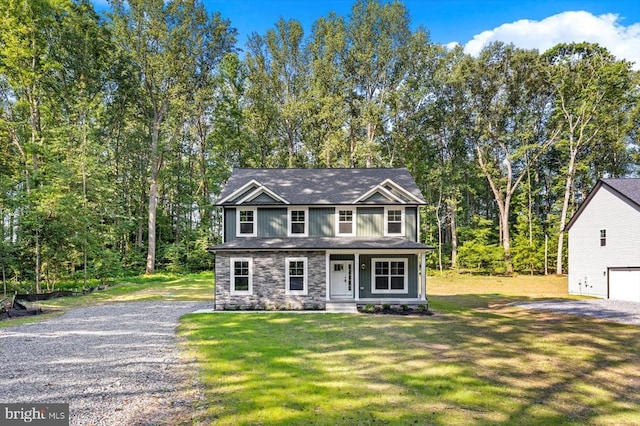 12521 Wilderness Park Dr, Spotsylvania, VA 22551 - view of front facade featuring stone siding, a front lawn, and covered porch