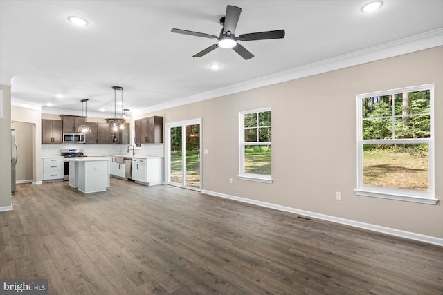 12521 Wilderness Park Dr, Spotsylvania, VA 22551 - unfurnished living room with crown molding, recessed lighting, a ceiling fan, and dark wood-type flooring