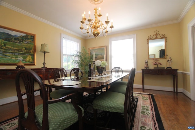 dining room with a chandelier, wood finished floors, ornamental molding, and baseboards